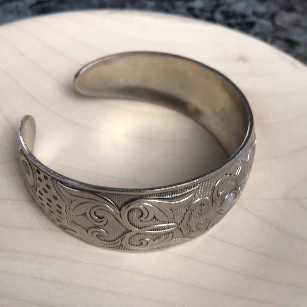 Signed embossed silver tone cuff